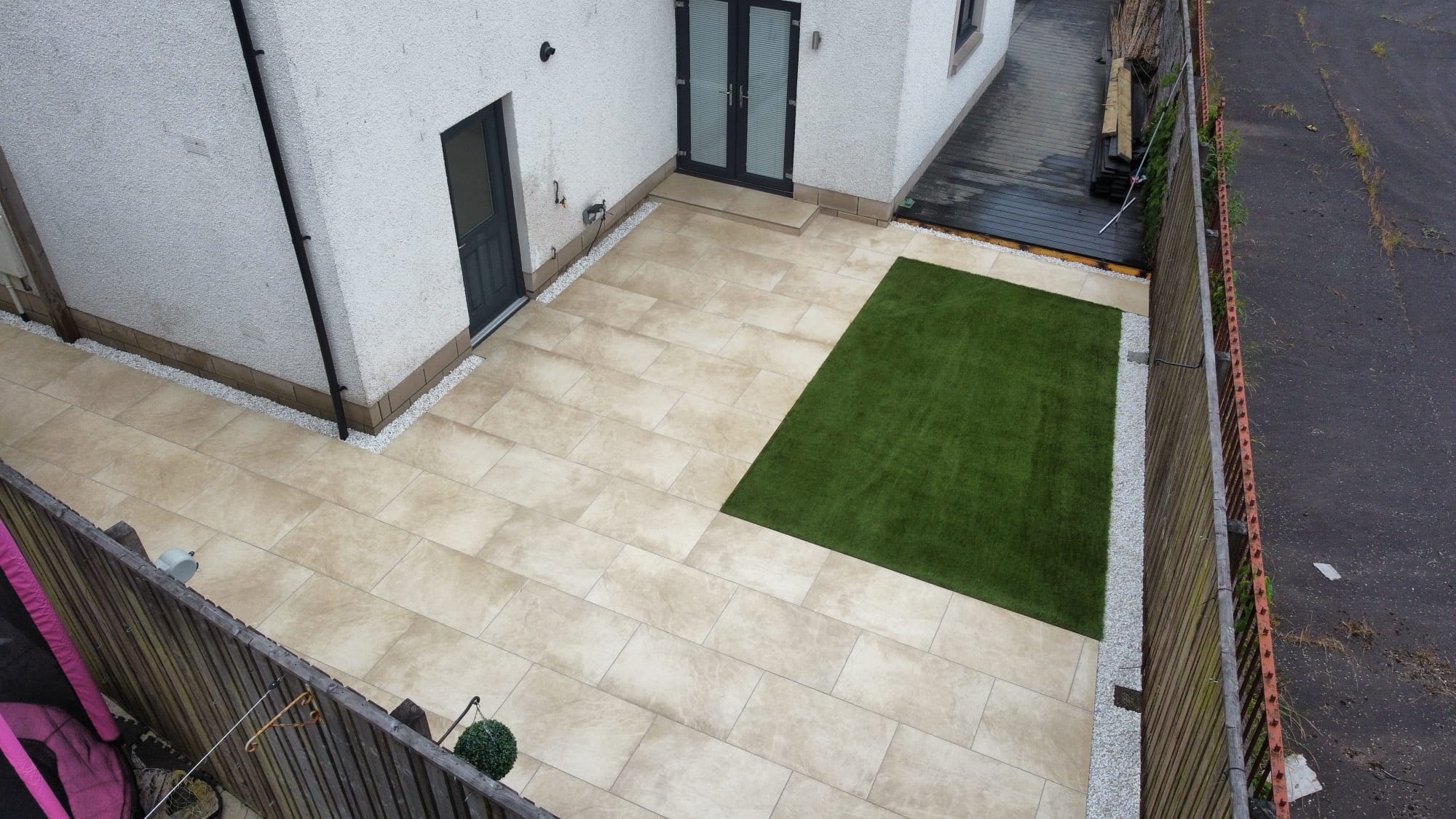 After — porcelain tiles and artificial grass