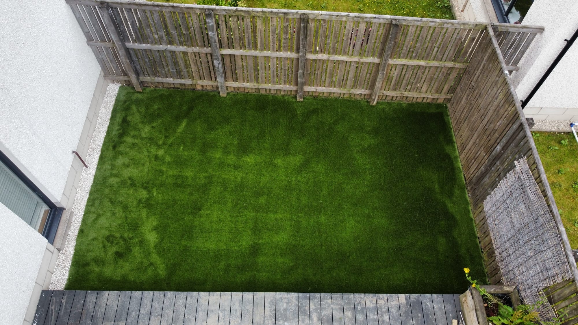 Green artificial turf backyard